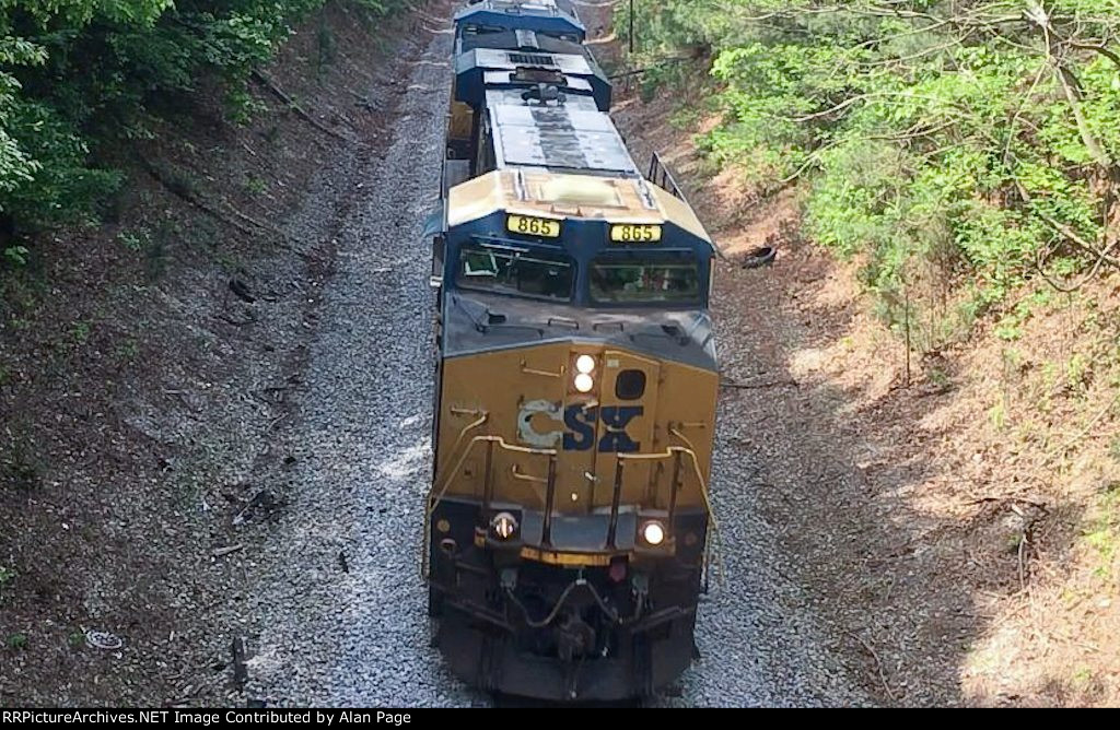 The old trestle bridge was rumbling as CSX 865 blasted underneath